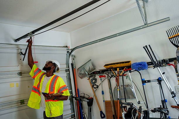 Professional Garage Door Roller Replacement technician working in Nora Springs, IA